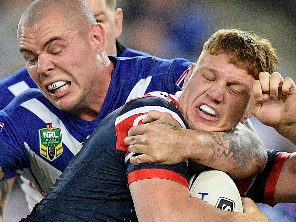 Dylan Napa of the Roosters is tackled by David Klemmer of the Bulldogs during the Round 11 NRL match between the Canterbury-Bankstown Bulldogs and the Sydney Roosters at ANZ Stadium in Sydney, Sunday, May 21, 2017. (AAP Image/Dan Himbrechts) NO ARCHIVING, EDITORIAL USE ONLY