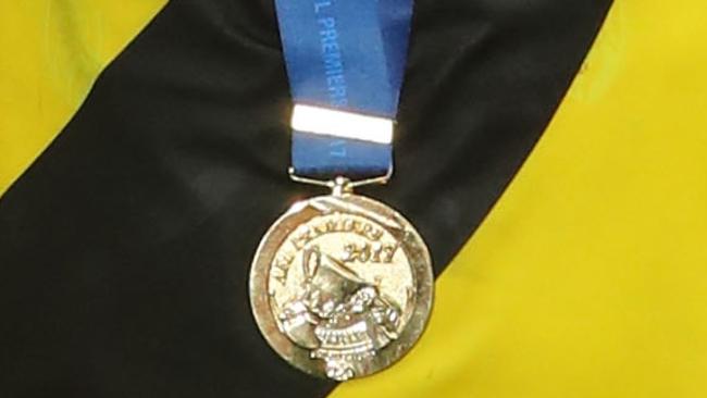 A Richmond play wears the 2017 Grand Final Medal