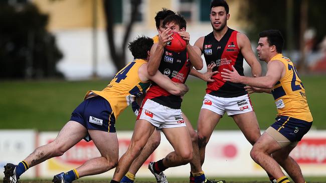 West Adelaide’s O'Brien doesn’t get a second as he’s tackled by Eagle Von Bertouch. Picture: Dean Martin.