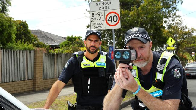 Geelong Highway Patrol Sergeant Damon Patralakis, left, and Acting Sergeant Jamie Davidson patrolling 40km/h school zones. Picture: Alison Wynd