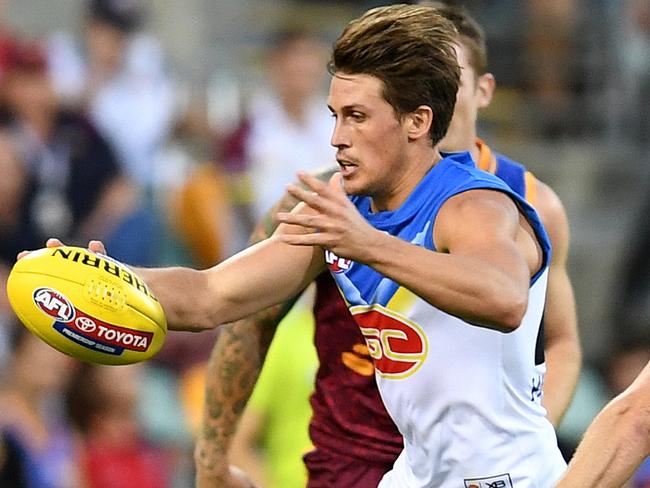 David Swallow of the Suns (left) is seen during the round 5 AFL match between the Brisbane Lions and the Gold Coast Suns at the Gabba in Brisbane, Sunday, April 22, 2018. (AAP Image/Dan Peled) NO ARCHIVING, EDITORIAL USE ONLY