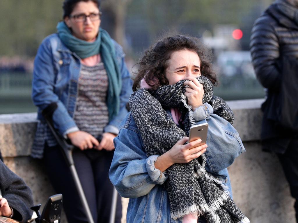 Bystanders were devastated by the fire. Picture: Geoffroy Van Der Hasselt / AFP