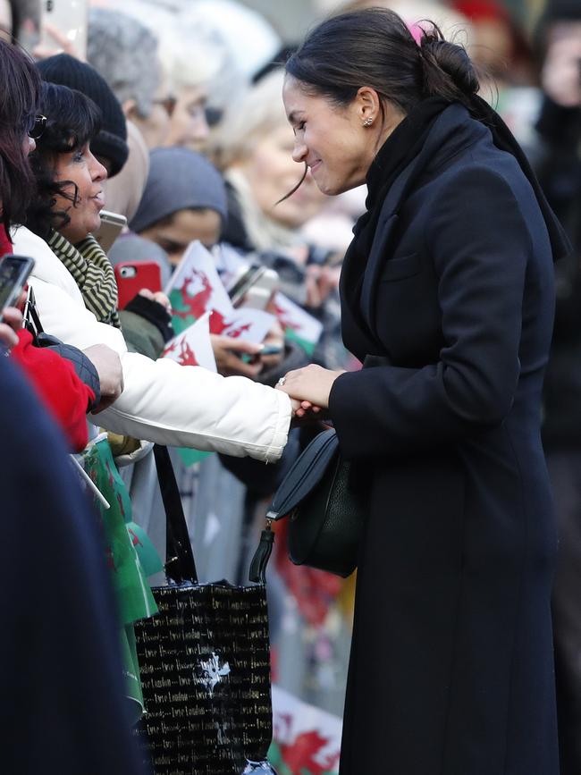 Meghan Markle meets fans as she arrives with Britain’s Prince Harry for a visit to Cardiff Castle in Cardiff, Wales, Thursday, Jan.18, 2018. Picture: AP