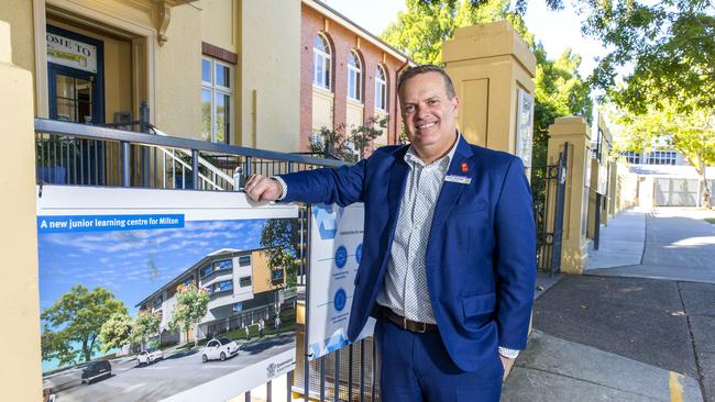 Milton State School Principal Paul Zernike with an artist’s impression of the new Junior Learning Centre. Picture: Richard Walker