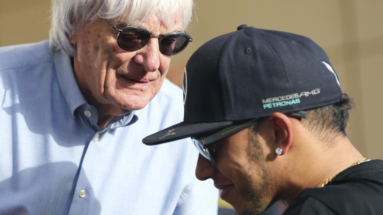 Bernie Ecclestone speaks with Hamilton in 2015.