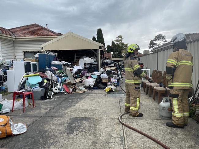 Fireys at the scene of a blaze in Fawkner where rubbish stopped firefighters getting to the flames. Picture: Himangi Singh