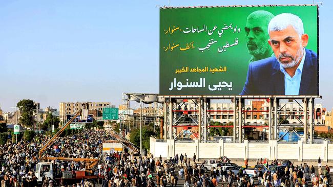 A billboard depicting Hamas' slain leader Yahya Sinwar with the Arabic slogan "if Sinwar departs from the battlefields, Palestine will birth a thousand Sinwars", during a rally in Yemen's Houthi-controlled capital Sanaa on October 18. Picture: Mohammed Huwais/AFP