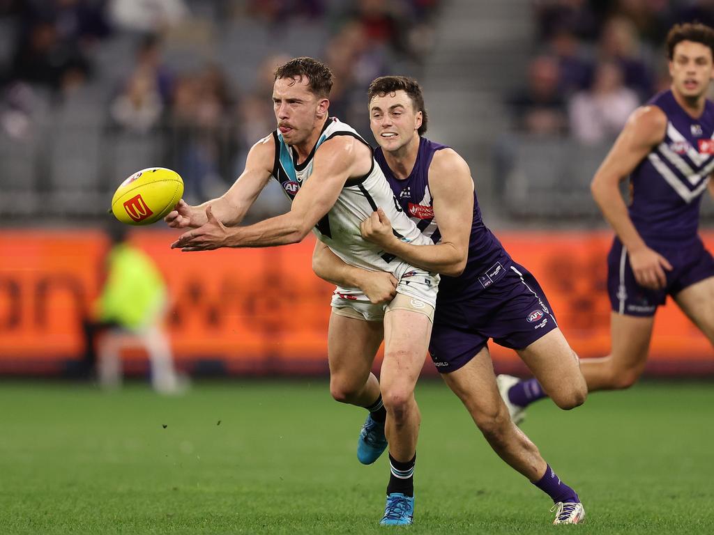 Francis Evans of the Power handballs during the round 24 AFL match against the Fremantle Dockers on August 25. Picture: Paul Kane/Getty Images