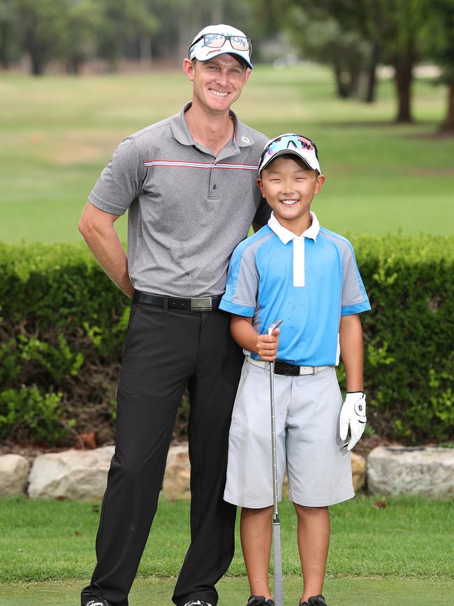 PGA golf professional Chris Willard coaches Jonathan Hong. Picture: Brett Costello