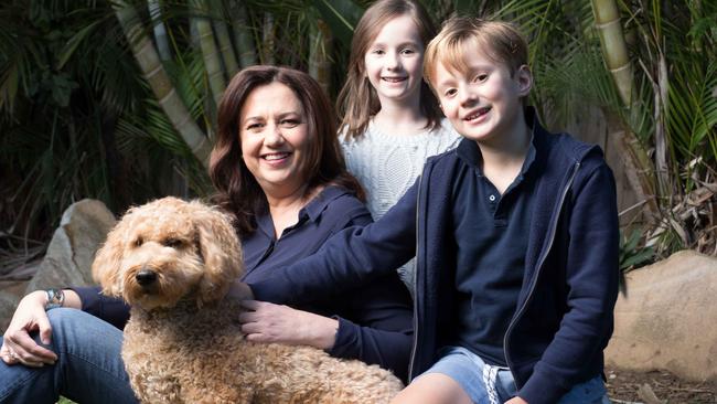 Queensland Premier Annastacia Palaszczuk at home with her dog Winton and niece Evelyn, 6, and nephew Harry.