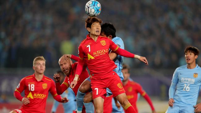 Adelaide United’s Kim Jae-sung heads the ball against Jiangsu Suning in March.