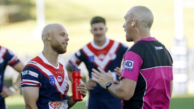 The referee speaks with Brad Speechley. Picture: John Appleyard