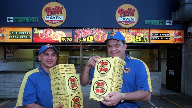 Louis and Bill Christou after securing rights to sell pizzas at Football Park in July, 2000.