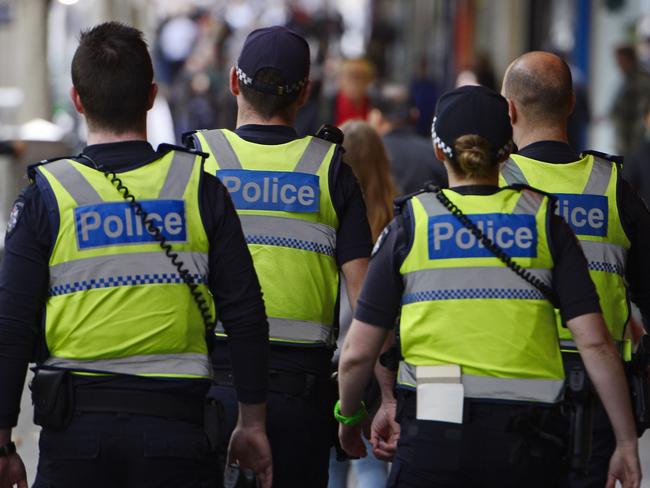 Police patrol along Swanston street. Picture: Stephen Harman