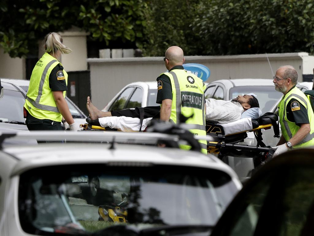 Ambulance staff take a man from outside a mosque in central Christchurch, New Zealand, Friday, March 15, 2019.(AP Photo/Mark Baker)