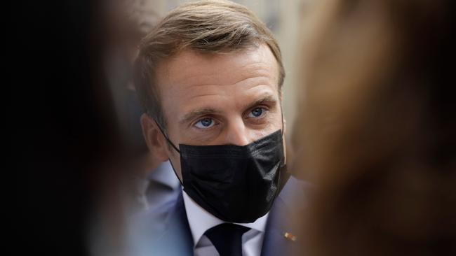 French President Emmanuel Macron talks to medical workers of the Rothschild hospital after visiting the association OSE, which takes care of sick, disabled children in Paris. Picture: Lewis Jol/AFP