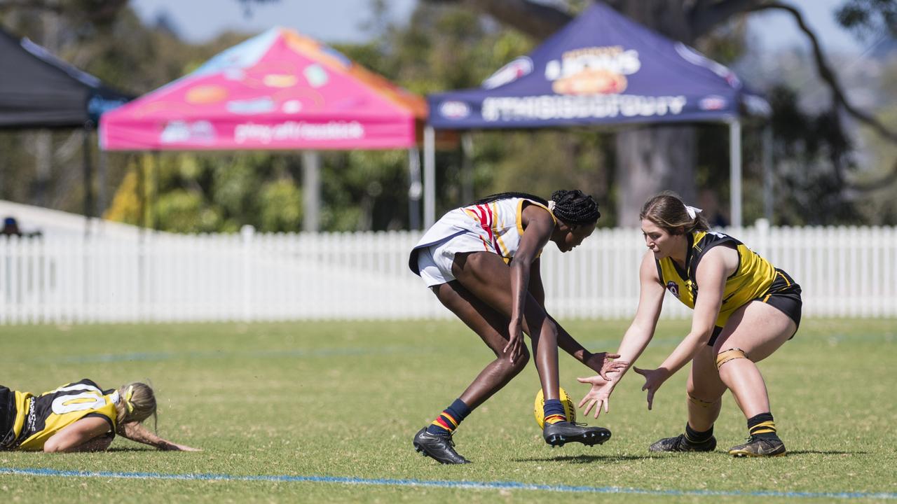 Apajok Deng (left) of University Cougars and Charlotte Artavilla-Bennett of Toowoomba Tigers in AFL Darling Downs Toowoomba Toyota Cup senior women grand final at Rockville Park, Saturday, September 2, 2023. Picture: Kevin Farmer