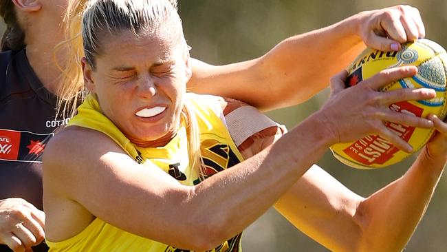 MELBOURNE, AUSTRALIA - NOVEMBER 03: Katie Brennan, Captain of the Tigers marks the ball during the 2024 AFLW Round 10 match between the Richmond Tigers and the Hawthorn Hawks at Swinburne Centre on November 03, 2024 in Melbourne, Australia. (Photo by Michael Willson/AFL Photos via Getty Images)