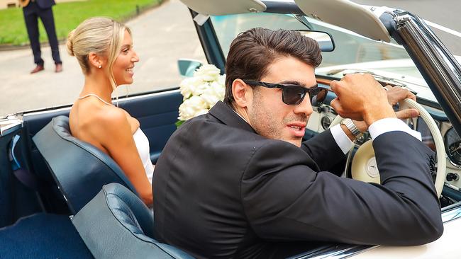 Melbourne footballer Christian Petracca and his wife Bella leave the Royal Botanical Gardens after getting married this afternoon. Picture: Ian Currie