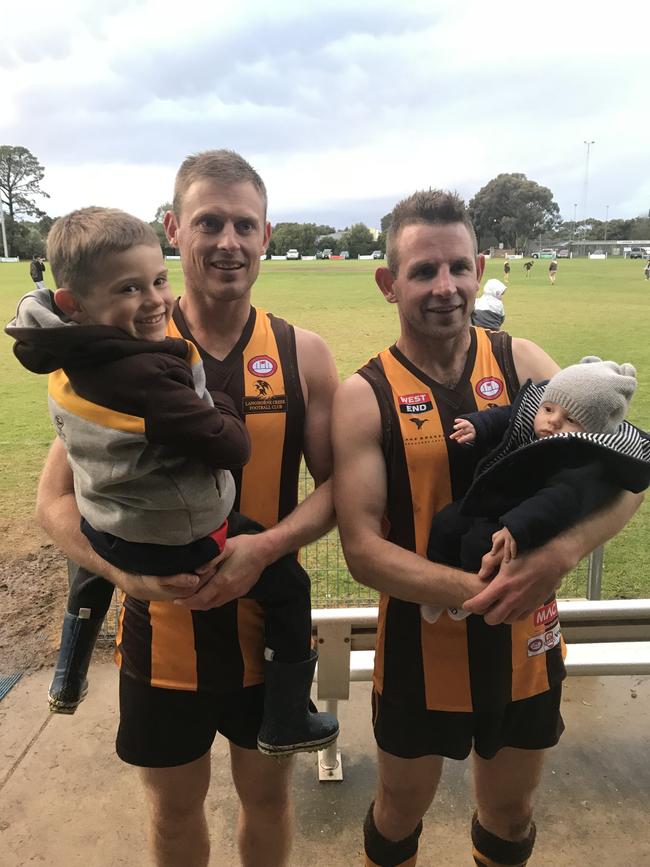 Ben Warren (left) with son Ashton and brother Nick Warren, with his son James, following Langhorne Creek’s GSFL flag triumph. Picture: Supplied