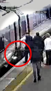 Terrifying moment child falls between train gap