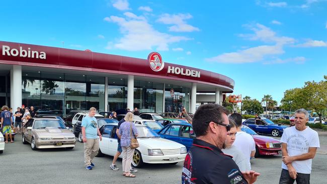 Holden fans gathered on October 10 for a final parade in front of the von Bibra Holden dealership in Robina before the sign came down.