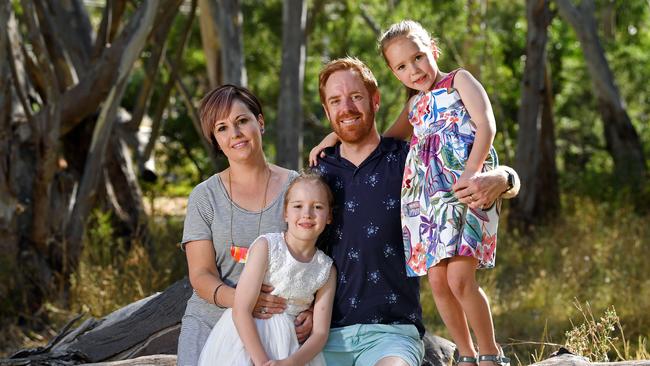 Todd Murfitt with wife Mandy at home with girls Ella, 10, and Mia, 7, at their Hahndorf home. Picture: Tom Huntely