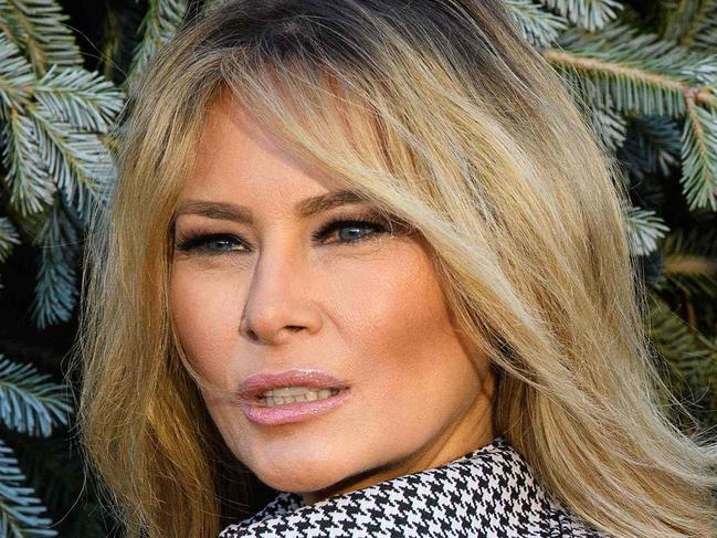 US First Lady Melania Trump receives the White House Christmas Tree at the White House in Washington, DC, on November 23, 2020. (Photo by NICHOLAS KAMM / AFP)