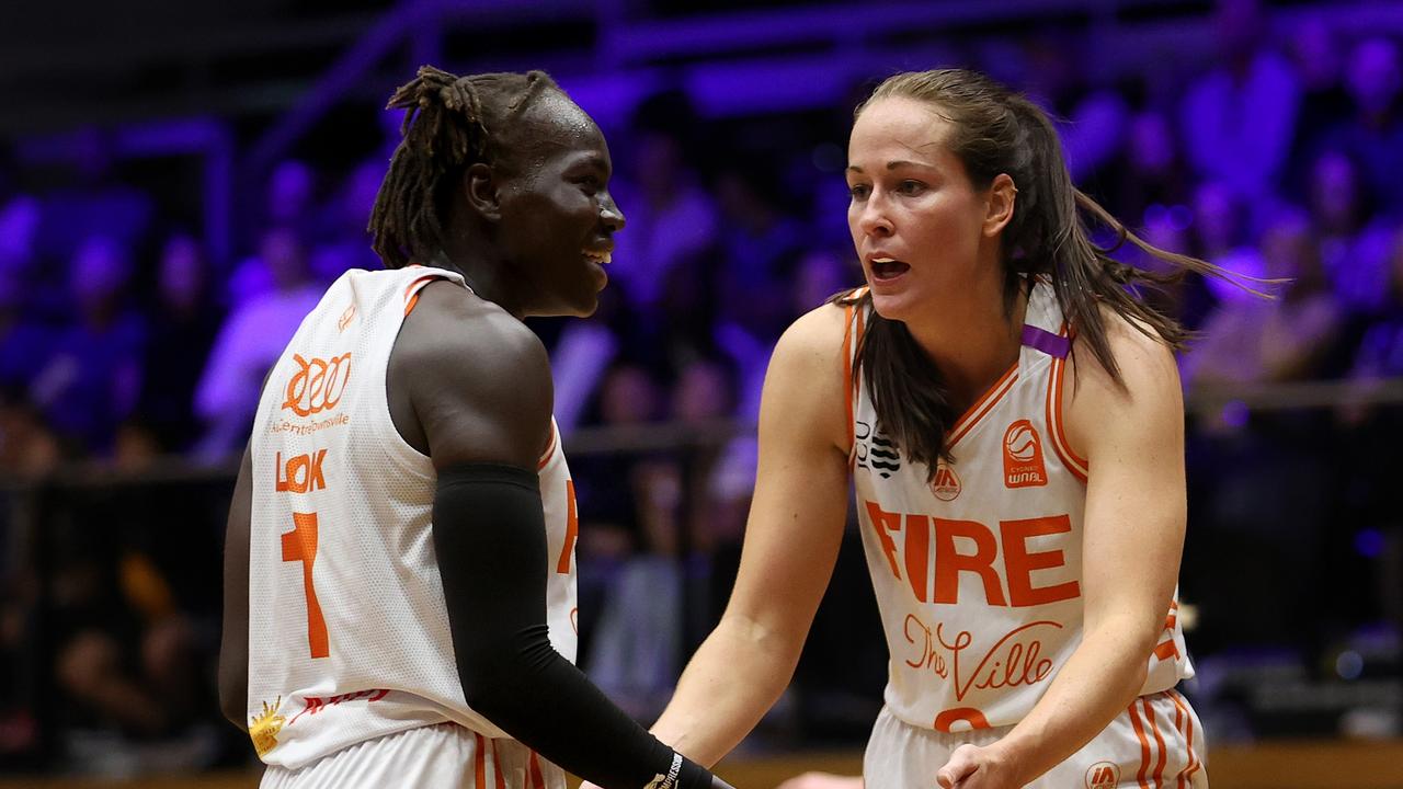 GEELONG, AUSTRALIA - OCTOBER 30: Nya Lok of the Townsville Fire and Alicia Froling of the Townsville Fire react during the round one WNBL match between Geelong United and Townsville Fire at The Geelong Arena, on October 30, 2024, in Geelong, Australia. (Photo by Kelly Defina/Getty Images)