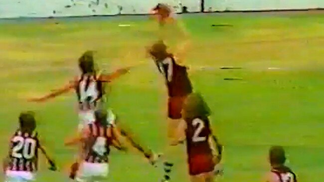 Western Districts QAFL player Ross Whyte takes the mark before kicking the winning goal in the 1977 Grand Final against Wilston Grange.