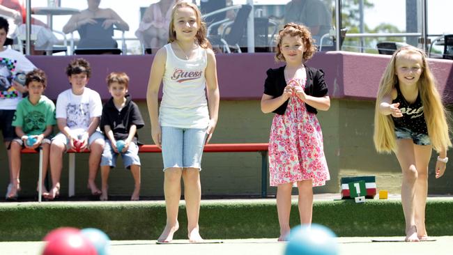 Natasha Kuzmanovic, Madison Roberts and Tyla Riley try Kids Lawn Bowling at Baulkham Hills Bowling Club.