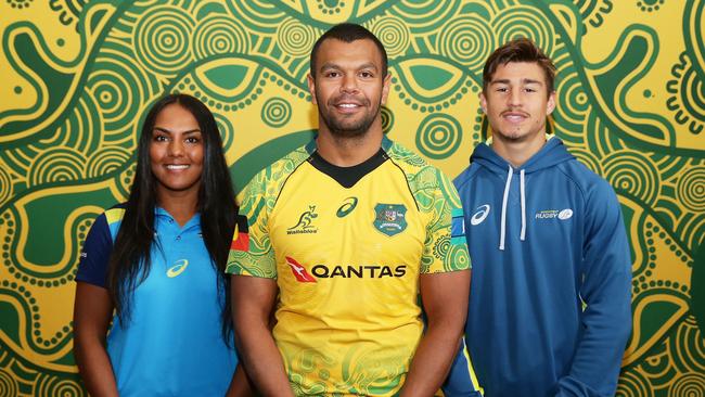 Kurtley Beale (C) in the Wallabies first indigenous jersey poses alongside Mahalia Murphy and Harrison Goddard. Picture: Getty