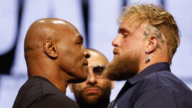 NEW YORK, NEW YORK - MAY 13: (L-R) Mike Tyson and Jake Paul speak onstage at the press conference in promotion for the upcoming Jake Paul vs. Mike Tyson boxing match at The Apollo Theater on May 13, 2024 in New York City. (Photo by Sarah Stier/Getty Images for Netflix)