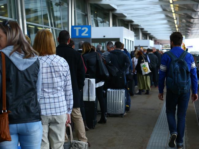 31/07/2017. People queue outside the terminal due to Increased delays at Sydney domestic airport as travellers are warned to arrive two hours earlier for flights because of Òadditional scrutinyÓ after authorities foiled a terrorist plot to bring down an aircraft using an improvised device over the weekend. Britta Campion / The Australian