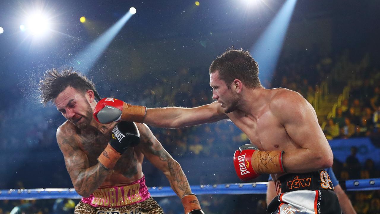 Stevie Spark (R) steps in to fight Tim Tszyu. Picture: Mark Metcalfe/Getty