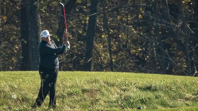 Then US President Donald Trump golfs at Trump National Golf Club, on November 7, 2020, in Sterling, Virginia, as news outlets were calling the presidential election for Democrat Joe Biden. Picture: Getty