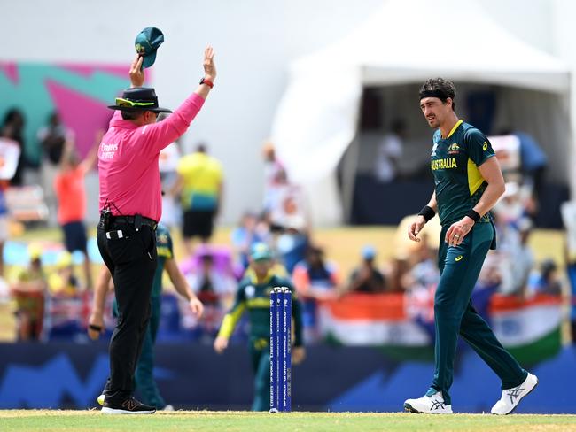 GROS ISLET, SAINT LUCIA - JUNE 24: Mitchell Starc of Australia reacts after being hit for a six by Rohit Sharma of India during the ICC Men's T20 Cricket World Cup West Indies & USA 2024 Super Eight match between Australia and India at Daren Sammy National Cricket Stadium on June 24, 2024 in Gros Islet, Saint Lucia. (Photo by Gareth Copley/Getty Images)