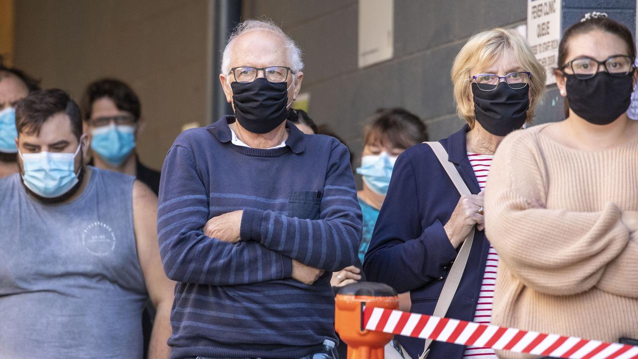 People are seen lining up to be tested for Covid-19 at a testing clinic at Ipswich Hospital. (Photo by Glenn Hunt/Getty Images)