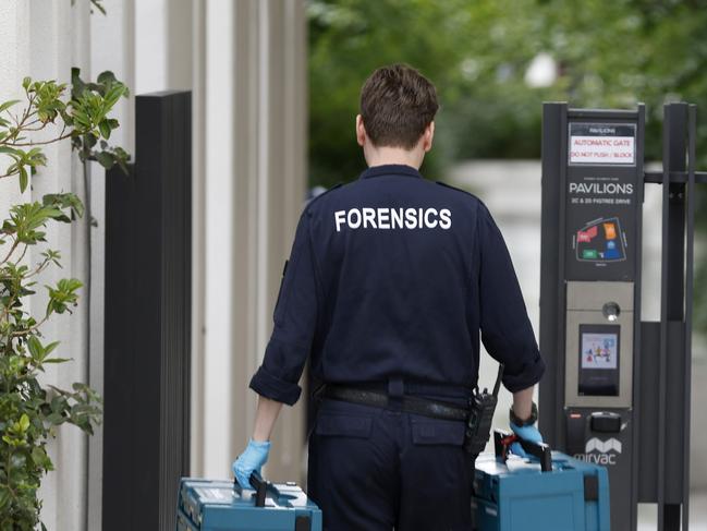 Forensics pictured outside an apartment building on Figtree Drive. Picture: NewsWire / Damian Shaw