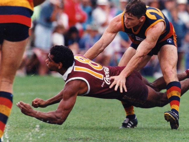 Footballer Mark Bickley (top) and Gilbert McAdam (bottom). AFL football — Adelaide Crows vs. Brisbane Bears trial match at Coolum. Used 07 Feb. 1994. (Pic by staff photographer Ray Titus)