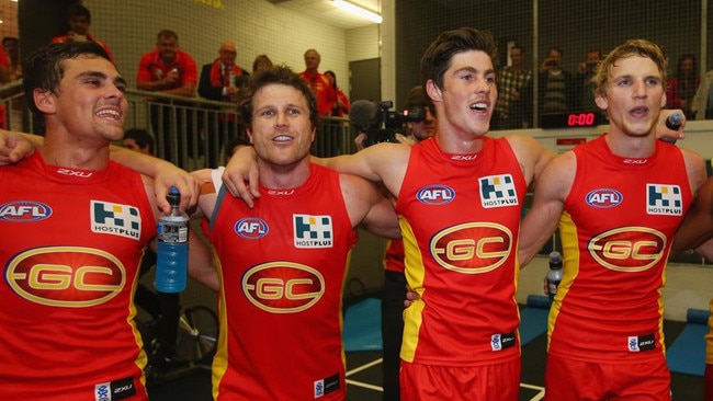 Campbell Brown sings the Gold Coast Suns team son. Photo by Chris Hyde/Getty Images.