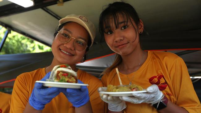 Servers at Hugs Pa Nim holding bao buns with laksa sauce at the 2024 Darwin International Laksa Festival on Sunday, November 3. Picture: Zizi Averill