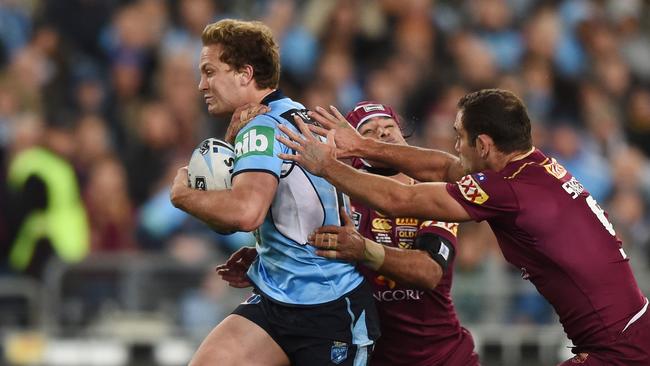 Matt Moylan of the Blues steps through a tackle.