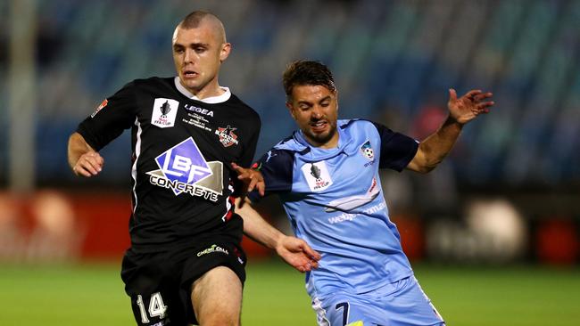 Blacktown Mitchell Mallia and Sydney FC's Michael Zullo compete for possession during the FFA Cup quarter Final between Sydney FC and Blacktown City