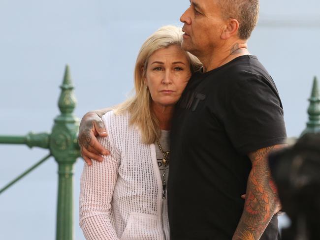 Couple watches on as passengers leave the ship. Ovation of the Seas Returns. The cruise liner will dock in Sydney after the tragic events on White Island, New Zealand. Picture Rohan Kelly