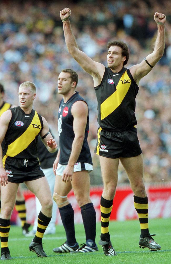 Matthew Richardson celebrates a goal in his only winning final appearance in 2001.