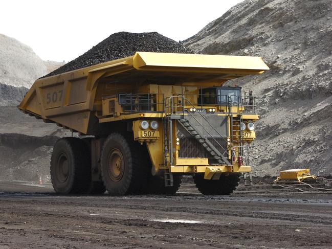 File - In this April 4, 2013, file photo, a mining dumper truck hauls coal at Cloud Peak Energy's Spring Creek strip mine near Decker, Mont. U.S. officials have approved a 117 million-ton expansion of a Montana coal mine after concluding that burning the fuel would have a minor impact on the nationâ€™s overall greenhouse gas emissions. Federal mining officials said in documents made public Thursday, Oct. 6, 2016, that burning coal from the Spring Creek Mine would generate roughly 160 million tons of carbon dioxide over the next five years. (AP Photo/Matthew Brown, File)