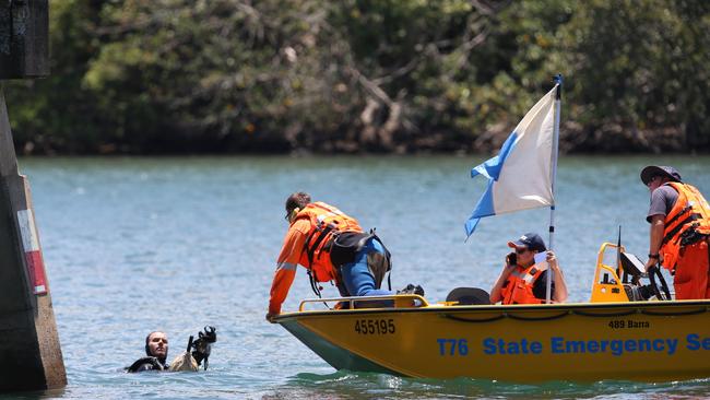 Police divers and SES members at the Tweed River this morning. Picture: Scott Powick