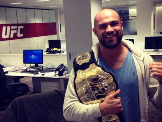 What a guy. Twitter photo of Pendred in the UFC office with a gold belt he hopes to earn one day.