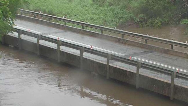 Water rose next to Crofton Creek Bridge as at 8am Monday. Photo: Whitsunday Regional Council